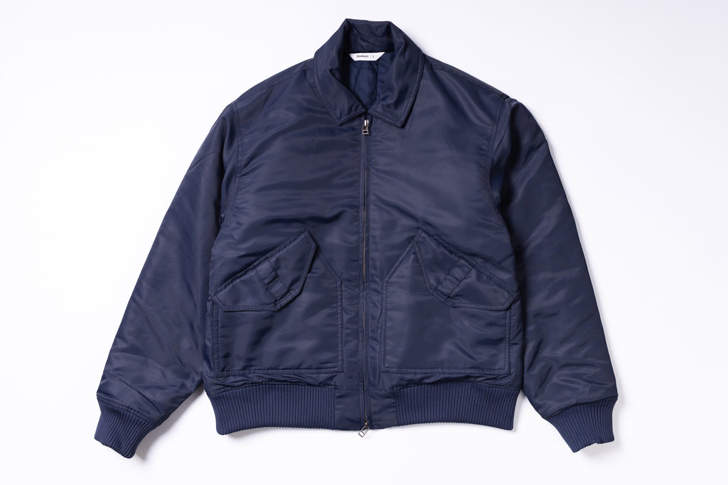 Navy blue bomber jacket on a white background