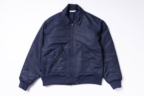 Navy blue bomber jacket on a white background