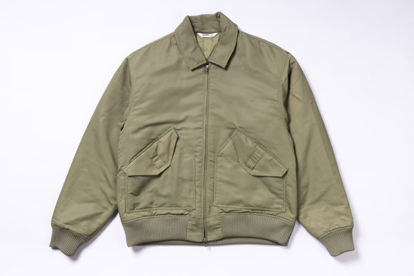 Green jacket with two front pockets on a white background