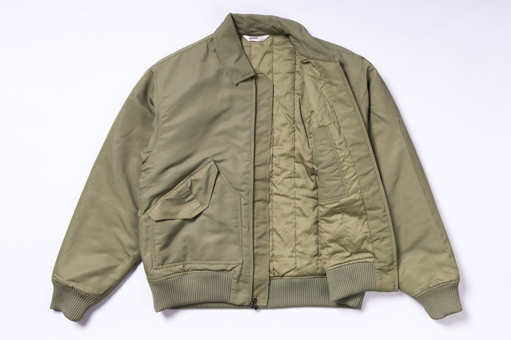 Green bomber jacket on a white background