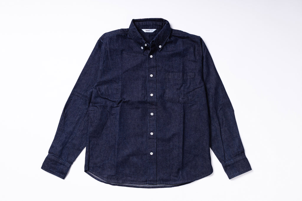Navy blue button-up shirt on a white background