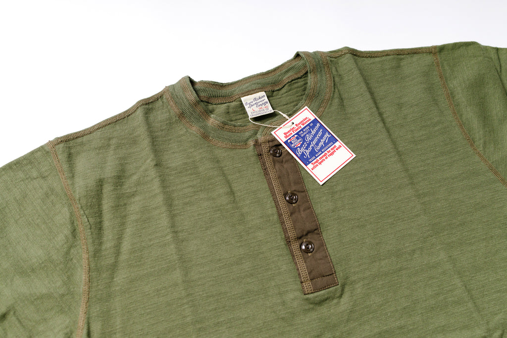 Green shirt with a tag on a white background