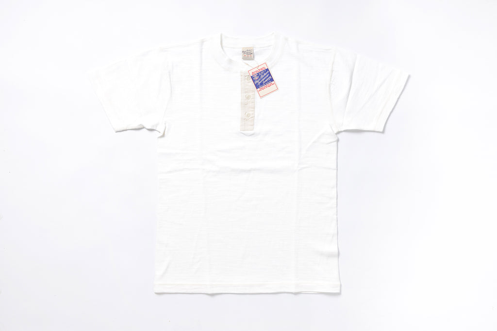 White t-shirt with a tag on a white background