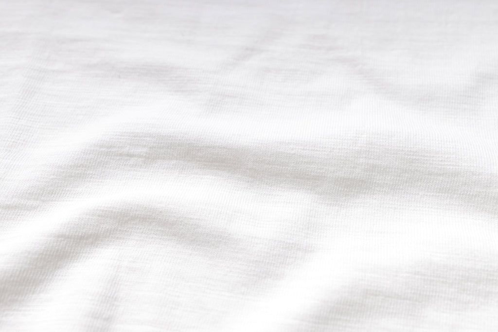 White fabric texture with subtle folds