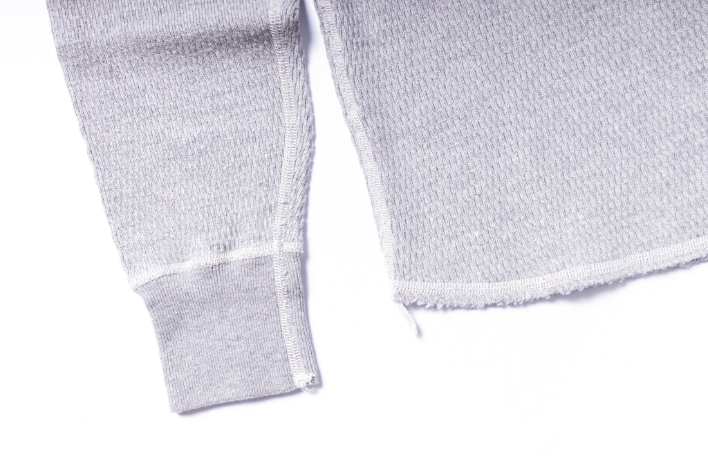 Close-up of textured white fabric on a white background