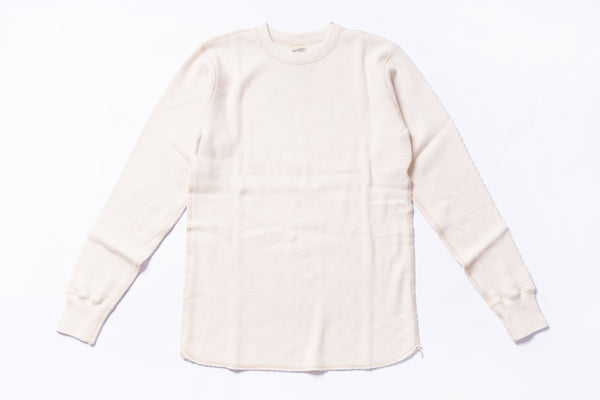 White long-sleeve shirt on a light gray background