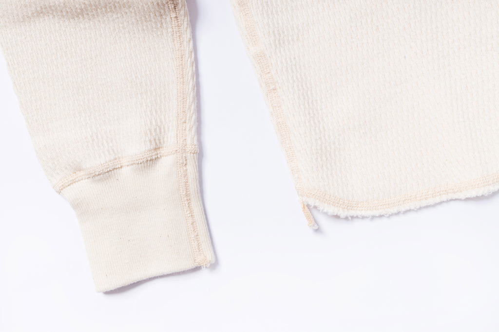 Close-up of beige fabric on a white background