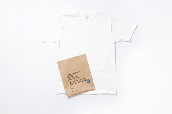 White t-shirt with a brown paper bag on a white background
