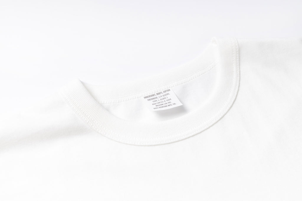 White shirt with a label on a white background