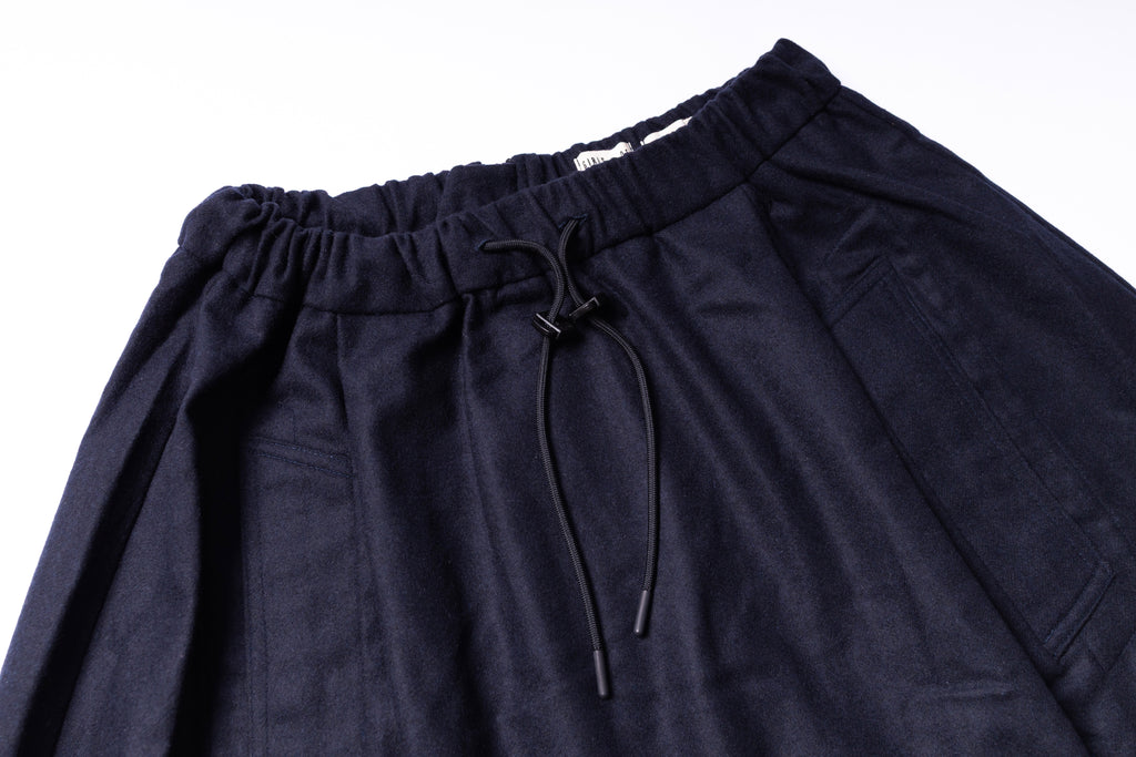 Navy blue skirt with drawstring on a white background