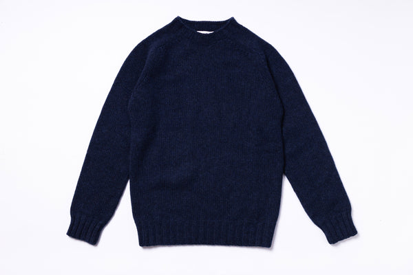 Navy blue sweater on a white background
