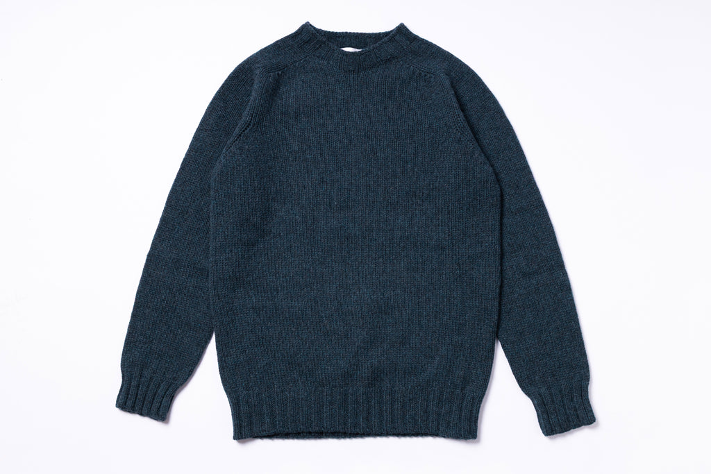 Dark blue sweater on a white background