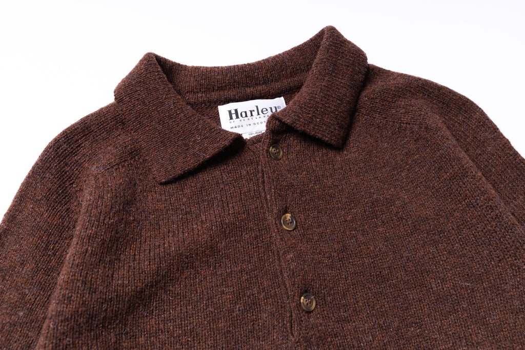 Brown knit polo shirt with collar and buttons on a white background