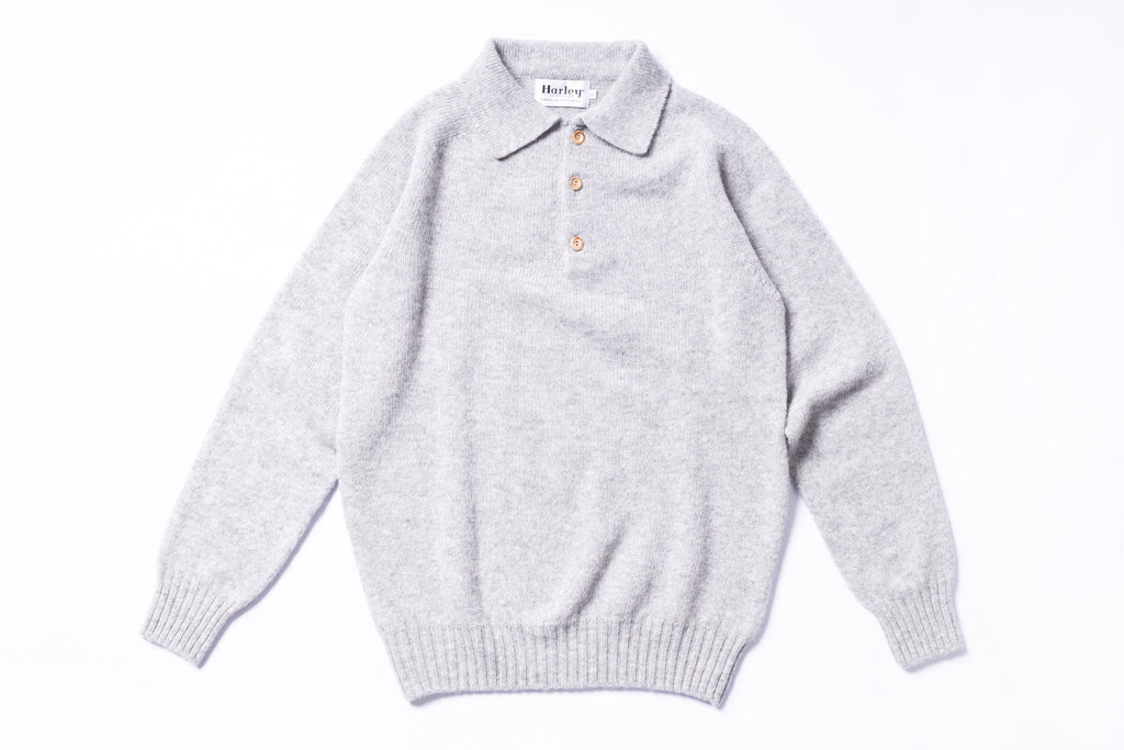 Gray sweater with a collar on a white background