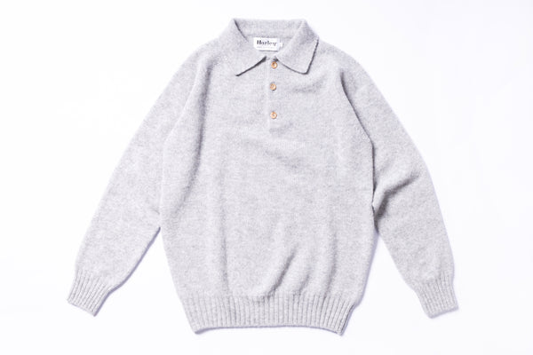 Gray sweater with a collar on a white background