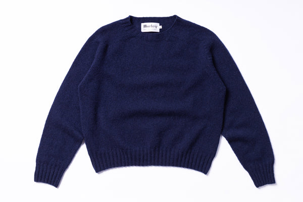 Navy blue sweater on a white background