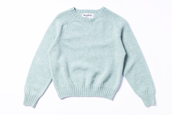 Light blue sweater with 'Harley' label on a white background