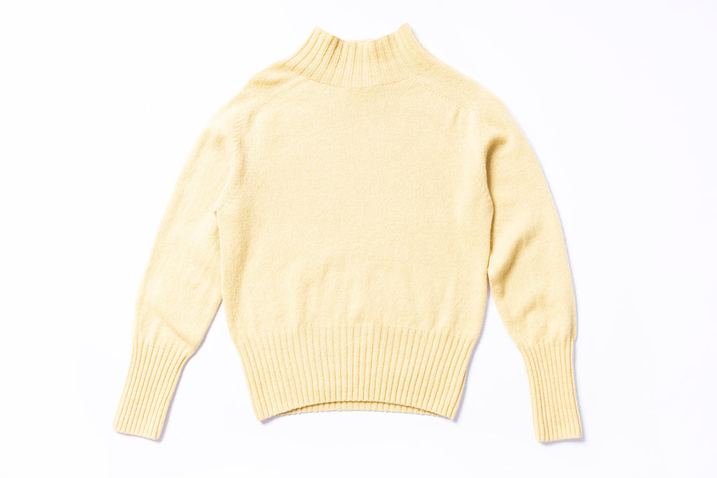 Yellow sweater on a white background