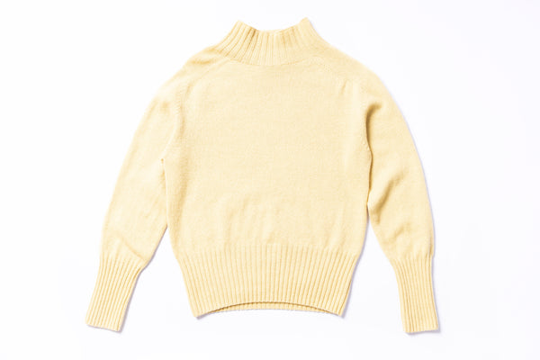 Yellow sweater on a white background