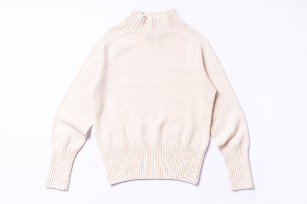 Beige sweater on a white background