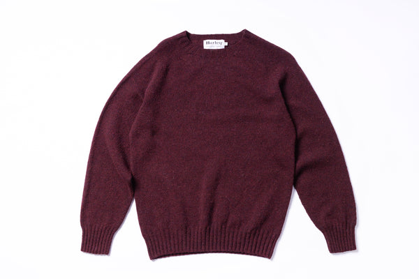 Maroon sweater on a white background