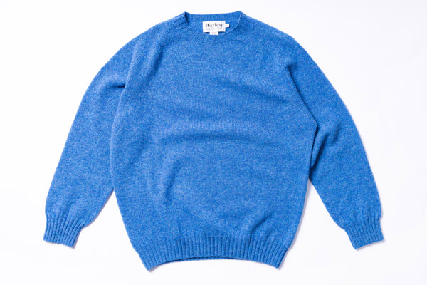 Blue sweater on a white background