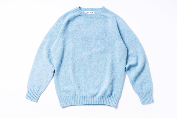 Light blue sweater on a white background