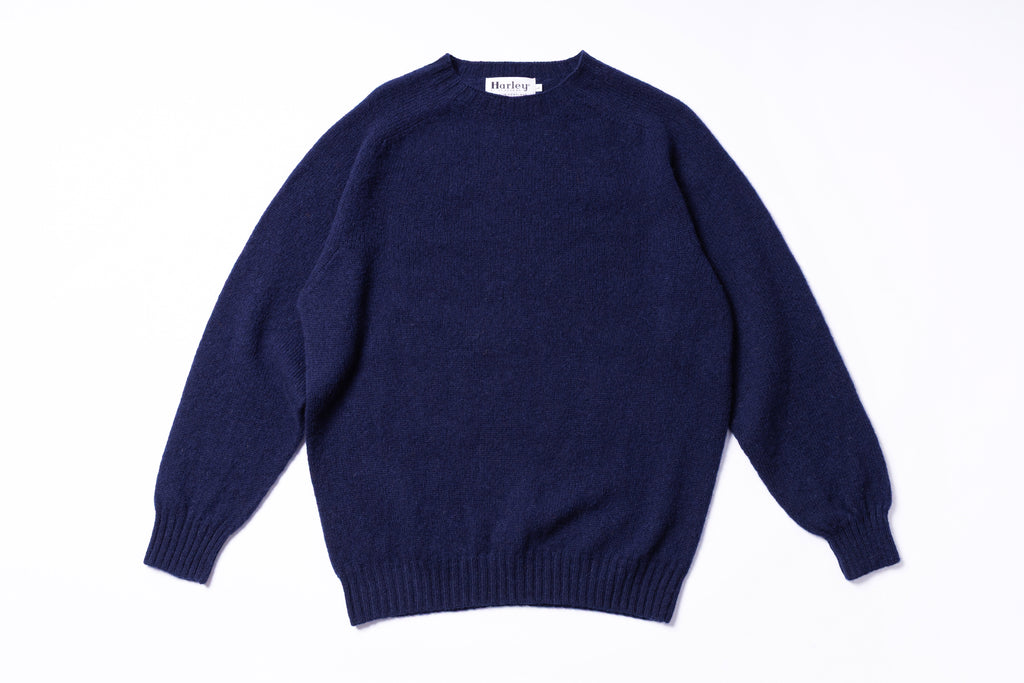 Navy blue sweater on a white background