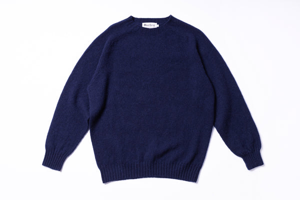 Navy blue sweater on a white background