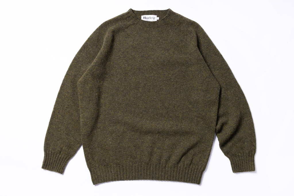 Green sweater on a white background