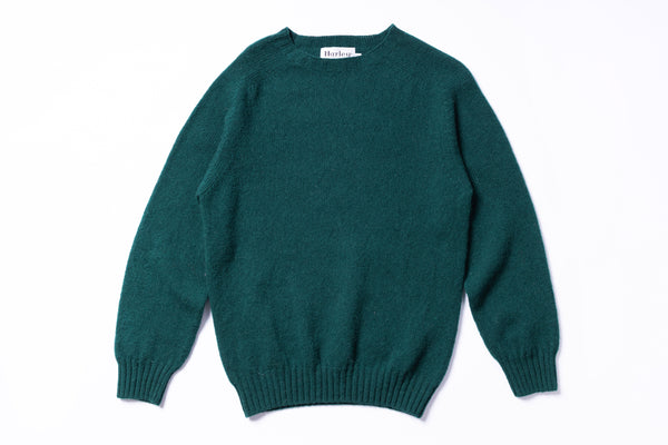 Green sweater on a white background