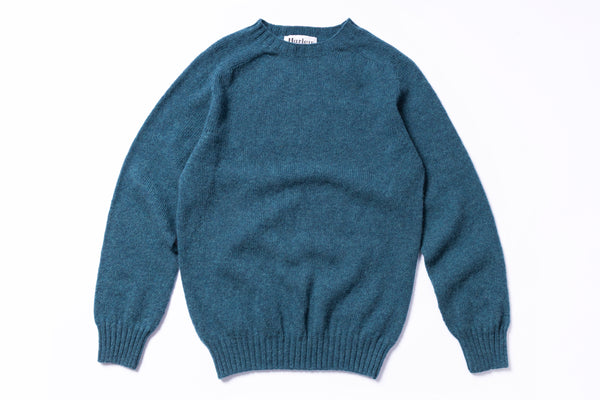 Blue sweater on a white background