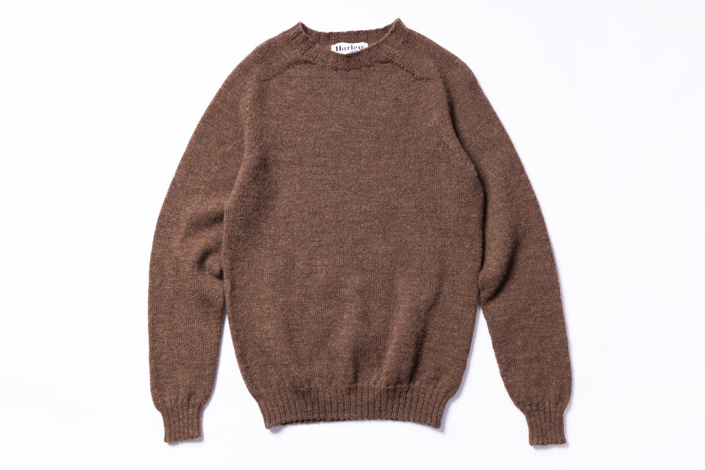 Brown sweater on a white background