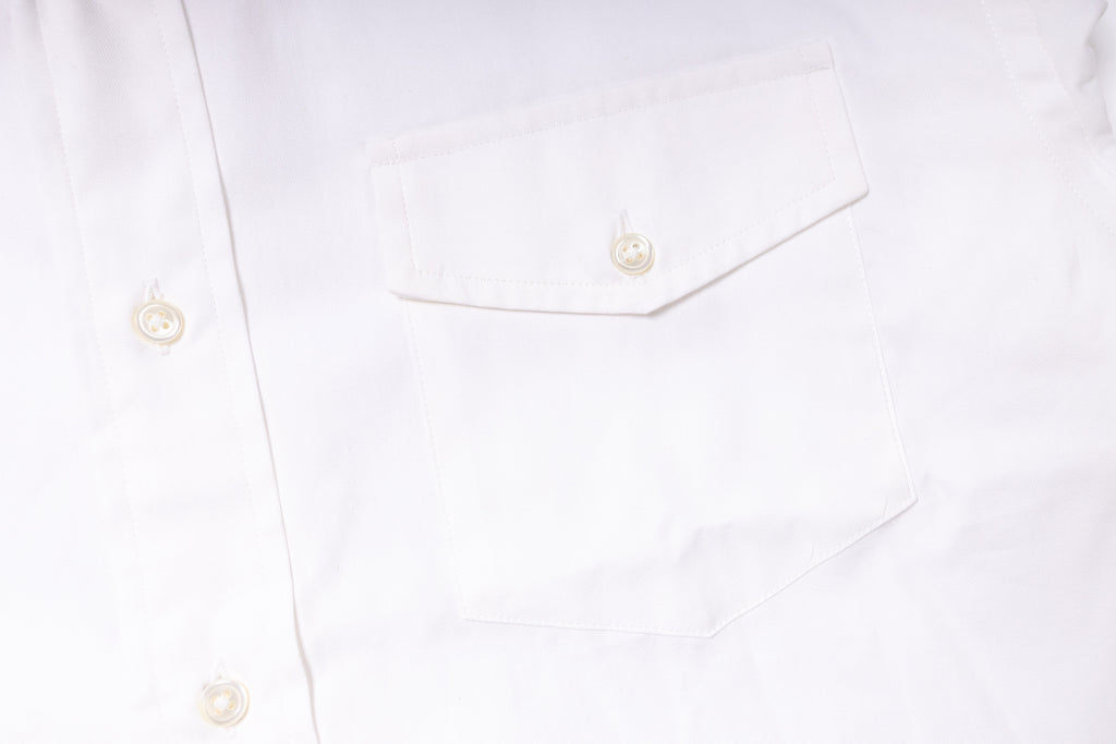 Close-up of a white shirt with buttons on a white background