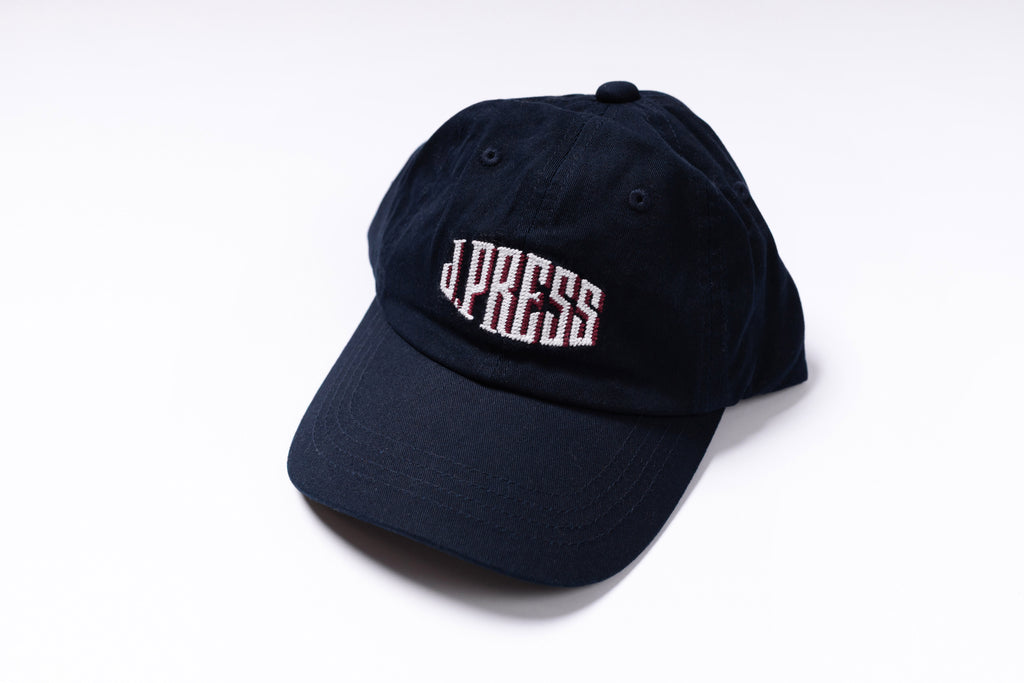 Navy blue cap with 'J.PRESS' logo on a white background