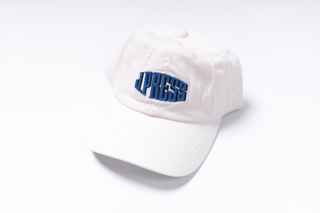 White cap with blue text on a white background