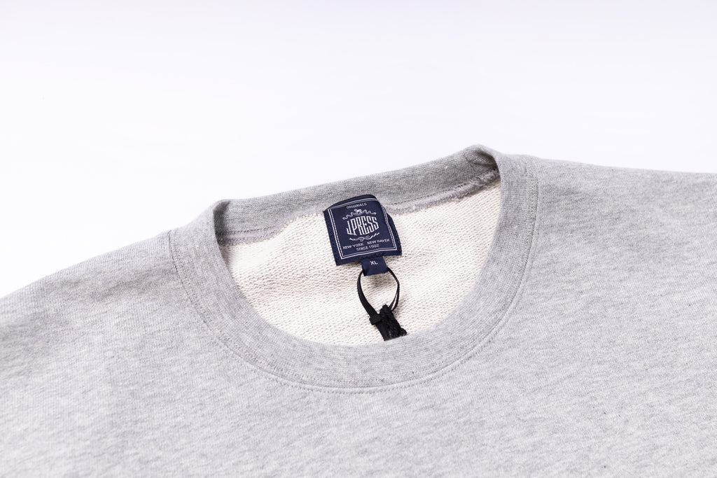 Gray sweatshirt with a brand tag on a white background
