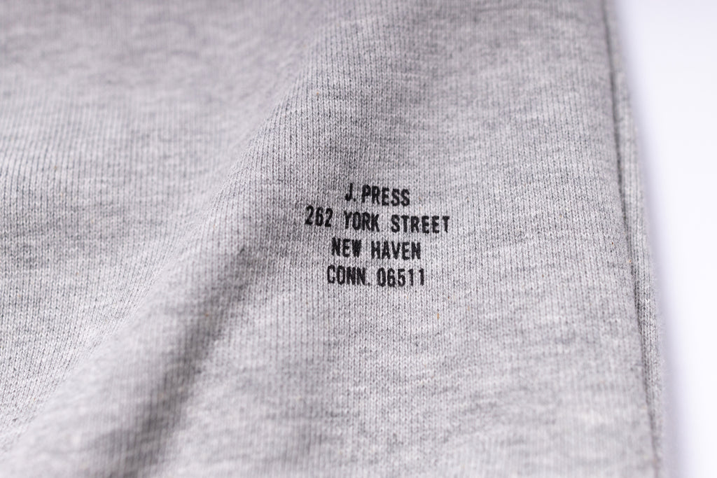 Gray fabric with black text label on a white background