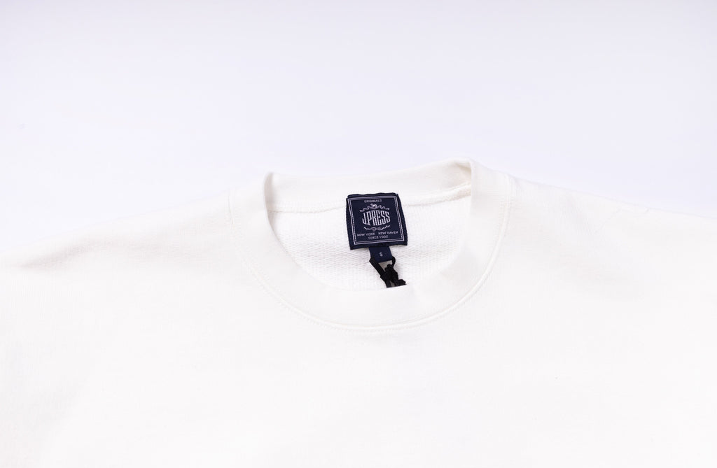 White shirt with a brand tag on a white background