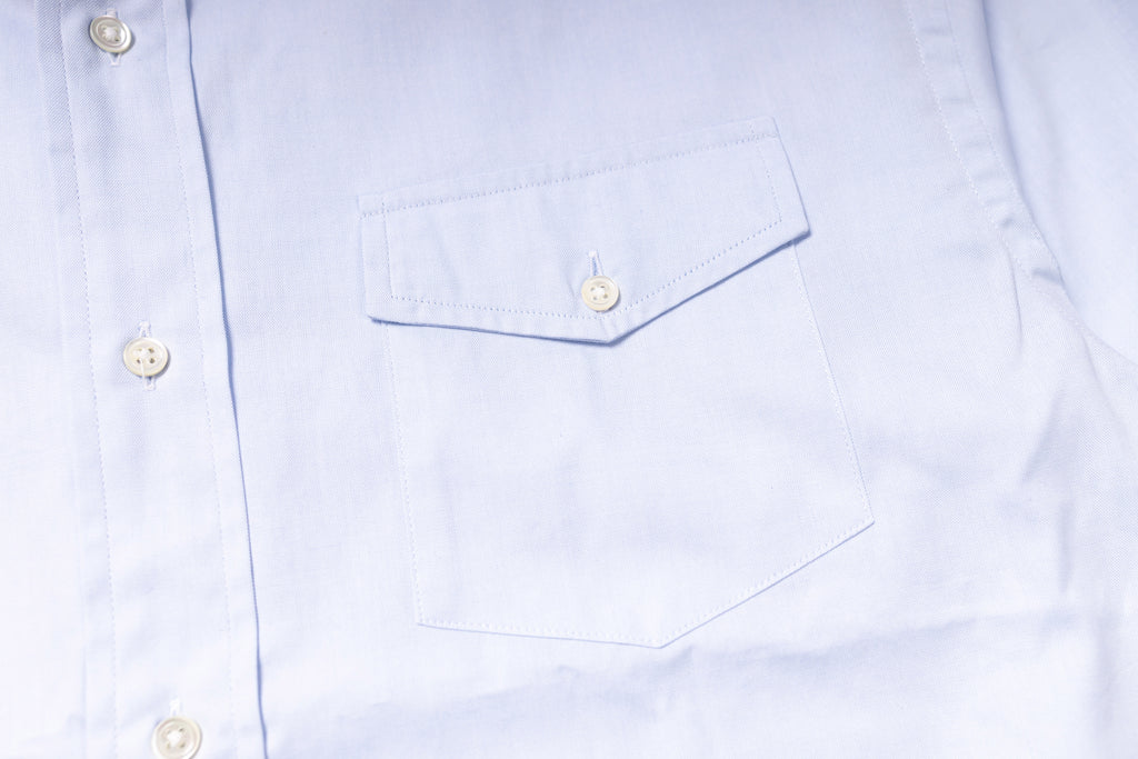 Close-up of a light blue shirt with button details