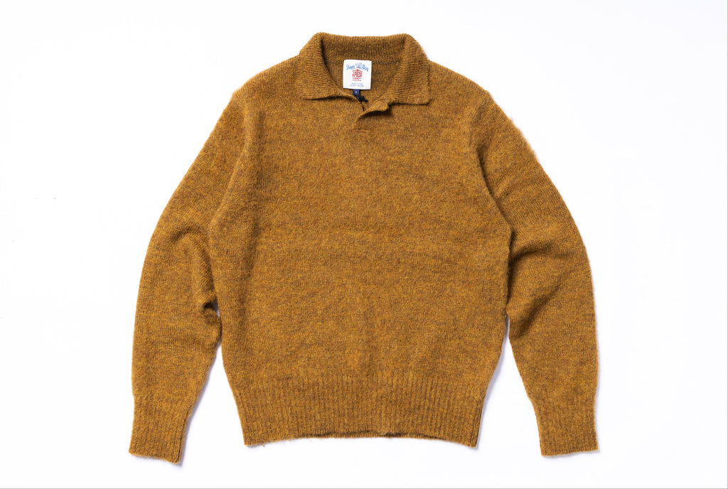 Brown sweater on a white background