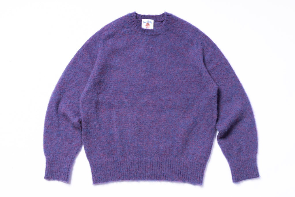 Purple sweater on a white background