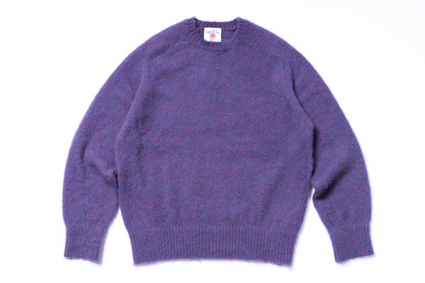 Purple sweater on a white background