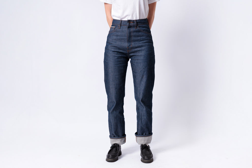 Person wearing blue jeans on a white background