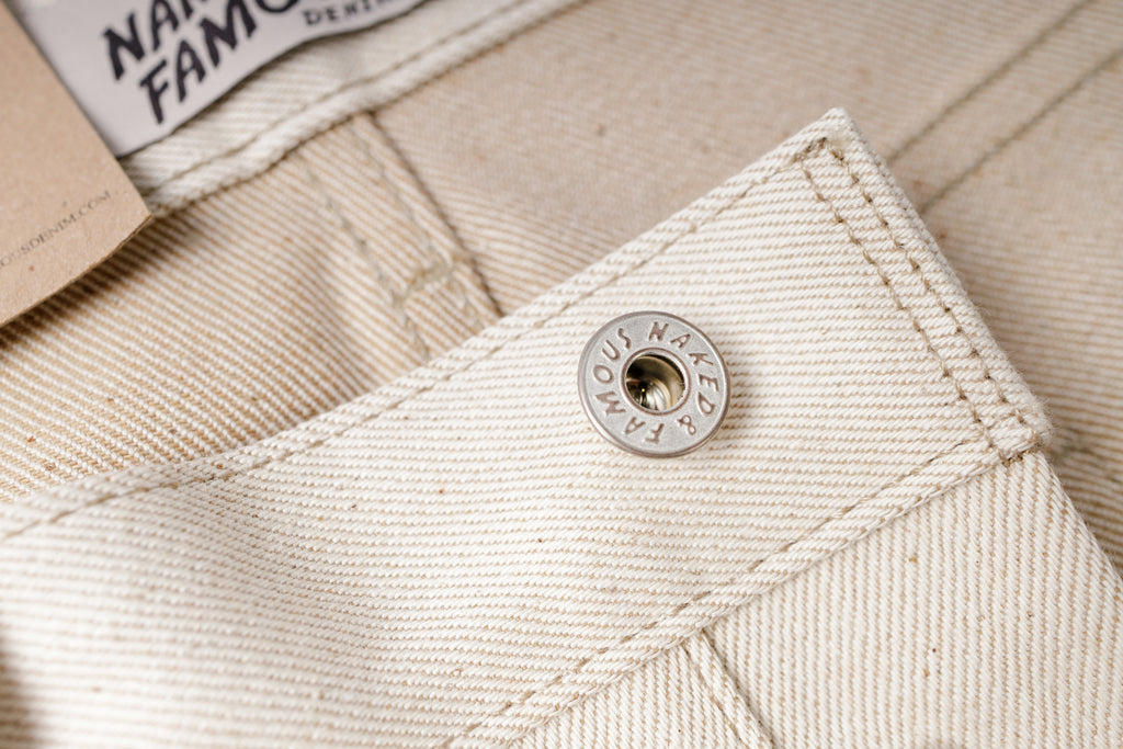 Close-up of a beige fabric with a button