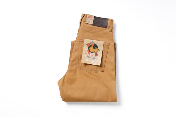 Folded brown pants with a label on a white background