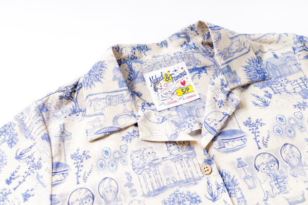 Blue and white patterned shirt with a brand label on a white background