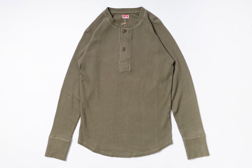 Green long-sleeve shirt on a white background