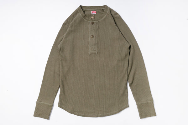 Green long-sleeve shirt on a white background