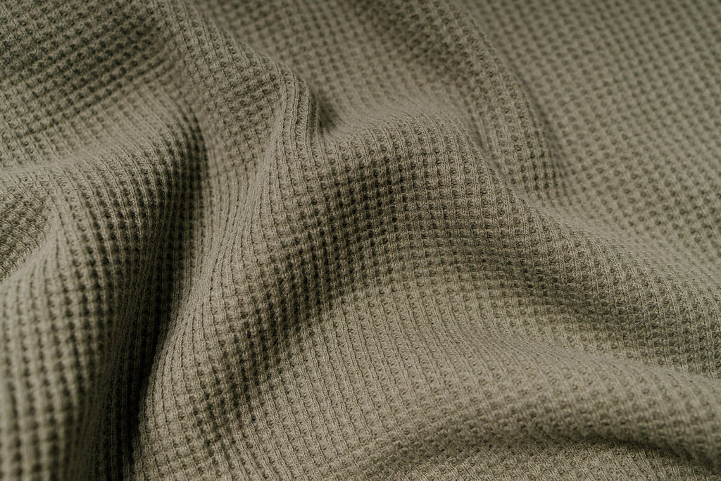 Close-up of textured green fabric